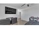 Bedroom featuring minimalist decor, light wood floors, and ample closet space at 7112 Samuel Ivy Dr, Tampa, FL 33619