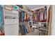 Spacious walk-in closet fully equipped with shelving, rods, and ample storage space at 7112 Samuel Ivy Dr, Tampa, FL 33619