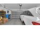 Spacious two-car garage with a car and storage available, and an automatic garage door at 7112 Samuel Ivy Dr, Tampa, FL 33619
