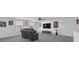 A comfortable living room featuring a plush sofa set and a wall-mounted TV at 7112 Samuel Ivy Dr, Tampa, FL 33619