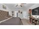 Expansive bedroom featuring hardwood floors, a cozy bed, and ample natural light, creating a serene and inviting retreat at 7112 Samuel Ivy Dr, Tampa, FL 33619