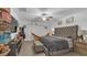 Spacious main bedroom with a cozy bed, a TV, hardwood floors, and a neutral palette for a calm and inviting atmosphere at 7112 Samuel Ivy Dr, Tampa, FL 33619