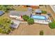 This aerial view showcases a home with a refreshing pool and a well-maintained outdoor space at 7421 Andre Dr, Zephyrhills, FL 33541