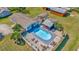 Aerial view of property featuring a backyard pool, fenced yard, and various seating arrangements at 7421 Andre Dr, Zephyrhills, FL 33541