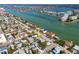 Scenic aerial view of a waterfront home, showcasing its proximity to the bay and surrounding community amenities at 8050 Boca Ciega Dr, St Pete Beach, FL 33706