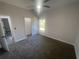 Bright bedroom with a large window and closet at 8204 Chimney Rock Dr, Webster, FL 33597