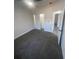 Carpeted bedroom features natural light and a large closet for organized storage at 8204 Chimney Rock Dr, Webster, FL 33597