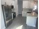 Modern kitchen with stainless steel appliances, white cabinets, and stylish countertop at 8204 Chimney Rock Dr, Webster, FL 33597