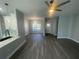 Open concept living space with modern flooring and contemporary lighting fixtures at 8204 Chimney Rock Dr, Webster, FL 33597