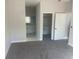 Carpeted main bedroom flows to main bathroom and features an oversized closet at 8204 Chimney Rock Dr, Webster, FL 33597