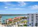 Scenic aerial view showing waterfront condos with red tile roofs and stunning views of the bay at 851 Bayway Blvd # 904, Clearwater Beach, FL 33767