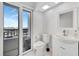 Clean and well-lit bathroom with modern fixtures and a balcony at 851 Bayway Blvd # 904, Clearwater Beach, FL 33767