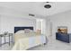 Bright bedroom with marble floors, a dresser and an open doorway to an additional room at 851 Bayway Blvd # 904, Clearwater Beach, FL 33767
