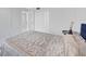 View of a bedroom with white walls, carpeted floor and closet at 851 Bayway Blvd # 904, Clearwater Beach, FL 33767