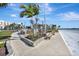 A scenic courtyard with seating areas, palm trees, and beach views at 851 Bayway Blvd # 904, Clearwater Beach, FL 33767