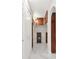 Hallway with marble floors, recessed lighting, and built-in storage cabinets and shelves at 851 Bayway Blvd # 904, Clearwater Beach, FL 33767