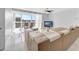 Bright living room with marble floors, large windows, modern furniture, and open layout, perfect for entertaining at 851 Bayway Blvd # 904, Clearwater Beach, FL 33767