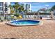 Community hot tub with lounge chairs and poolside seating at 851 Bayway Blvd # 904, Clearwater Beach, FL 33767