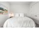 Serene bedroom features neutral decor, a comfortable bed, and a serene ambiance at 8721 Drummer Plank Dr, Wesley Chapel, FL 33545