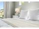 Cozy bedroom details with soft, light colors and backyard views at 8721 Drummer Plank Dr, Wesley Chapel, FL 33545