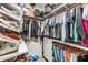 Spacious walk-in closet with ample shelving and storage at 8721 Drummer Plank Dr, Wesley Chapel, FL 33545