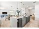 Spacious kitchen features a large island with seating, stainless steel appliances and an open floorplan concept at 8721 Drummer Plank Dr, Wesley Chapel, FL 33545