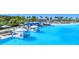 Exclusive lagoon view featuring private floating cabanas, beach access, and clear blue water at 8721 Drummer Plank Dr, Wesley Chapel, FL 33545