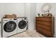 Well-equipped laundry room with modern washer and dryer at 8721 Drummer Plank Dr, Wesley Chapel, FL 33545