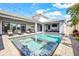 Inviting backyard pool and spa surrounded by outdoor seating and mature landscaping, perfect for relaxation at 8721 Drummer Plank Dr, Wesley Chapel, FL 33545