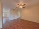 Open concept living room with modern ceiling fan and vinyl flooring at 9009 Pebble Creek Dr, Tampa, FL 33647