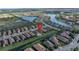Aerial view of the neighborhood with its manicured landscaping and beautiful lake views at 10446 Highland Park Pl, Palmetto, FL 34221