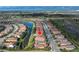 Aerial view of the community surrounded by well maintained landscaping, water views and lush greenery at 10446 Highland Park Pl, Palmetto, FL 34221