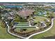 Community includes a clubhouse, bocce ball court, event lawn, walking paths, lake access and tropical landscaping at 10446 Highland Park Pl, Palmetto, FL 34221