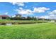 Expansive backyard with pond views at 10446 Highland Park Pl, Palmetto, FL 34221