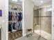 Bathroom with a walk-in closet and a walk-in shower with glass doors at 10446 Highland Park Pl, Palmetto, FL 34221