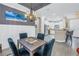 Open concept dining room with a view of the kitchen and stylish lighting at 10446 Highland Park Pl, Palmetto, FL 34221