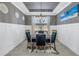 Formal dining room featuring modern lighting and stylish decor and large format ceramic tile floors at 10446 Highland Park Pl, Palmetto, FL 34221
