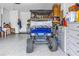 Spacious garage with epoxied floors and golf cart at 10446 Highland Park Pl, Palmetto, FL 34221