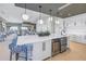 Open concept kitchen with modern appliances, large island, and barstool seating available at 10446 Highland Park Pl, Palmetto, FL 34221