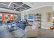 Inviting living room with modern decor, comfortable seating, and sliding doors to the lanai at 10446 Highland Park Pl, Palmetto, FL 34221