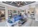This open-concept living room features stylish furnishings, lighting, and easy kitchen access at 10446 Highland Park Pl, Palmetto, FL 34221