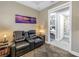 Living area with leather seating and access to bedroom and bathroom at 10446 Highland Park Pl, Palmetto, FL 34221