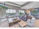 Relaxing lounge area with comfortable seating, a large coffee table, and stylish decor at 10446 Highland Park Pl, Palmetto, FL 34221