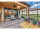 Charming screened-in patio with ceiling fan and beautiful outdoor view at 10446 Highland Park Pl, Palmetto, FL 34221