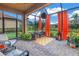 Relaxing screened patio with comfortable seating and a view of the landscaped yard at 10446 Highland Park Pl, Palmetto, FL 34221