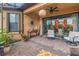 Covered patio with brick flooring, seating area and ceiling fan at 10446 Highland Park Pl, Palmetto, FL 34221