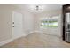 Cozy breakfast nook with sliding glass doors leading to the outdoor space at 1180 Eden Isle Ne Blvd, St Petersburg, FL 33704
