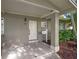 A welcoming front entrance features a clean-lined door, a modern mailbox, and neat landscaping at 1180 Eden Isle Ne Blvd, St Petersburg, FL 33704