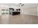 Expansive living space flows into the kitchen, featuring stainless steel appliances and a large sliding glass door at 1180 Eden Isle Ne Blvd, St Petersburg, FL 33704