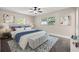 Beautiful bedroom featuring a ceiling fan, bench, and natural light from the windows at 1180 Eden Isle Ne Blvd, St Petersburg, FL 33704